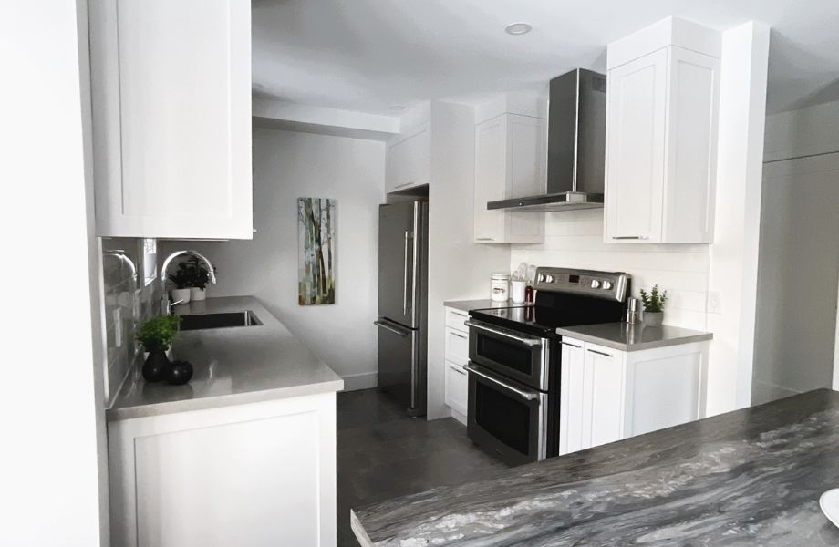 Kitchen with white cabinets and stainless steel appliances