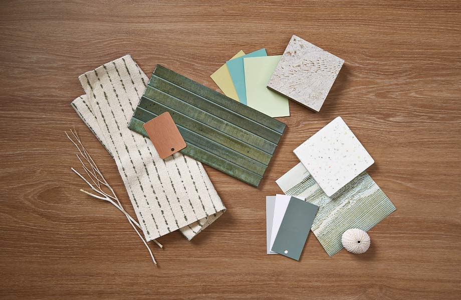Design palette featuring green, blue, brown and cream colored samples of fabric, tile and woodgrains from Formica Group and FENIX Innovative Materials
