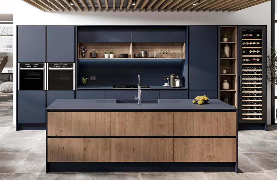 High-end kitchen with FENIX Blu Fes countertops and cabinets, large island with sink, double ovens and wine fridge