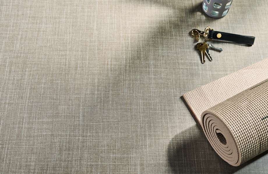 Keys, water bottle and yoga mat on Sisal Fabric Formica Laminate surface    