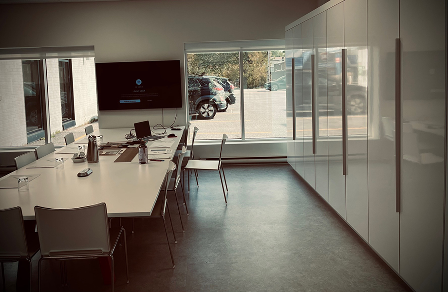 An office meeting and break room with markerboard cabinets